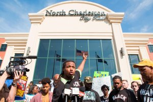 Muhiydin Moye addresses the crowd at a 2015 Walter Scott demonstration in North Charleston. (Credit: Alex Holt/The Washington Post/Getty Images)
