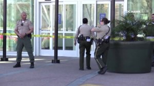 Officers stand outside the Moreno Valley Mall after reports of gunfire triggered a lockdown on Feb. 8, 2018. (Credit: OC Hawk)