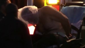 Paramedics treat a man identified as Antonio Padilla Jr. after police and a K-9 apprehended him in Irvine after a pursuit on Feb. 26, 2018. (Credit: KTLA)