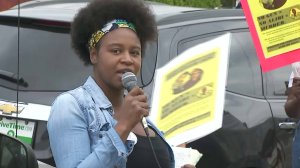 A woman speaks on Feb. 10, 2018, during protests in South Los Angeles in the name of Anthony Weber, a teen who was shot dead by an L.A. County sheriff's deputy about a week earlier. (Credit: KTLA)