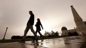 Two people walk outside the Griffith Observatory after a rainstorm in November 2017. (Credit: Al Seib / Los Angeles Times)