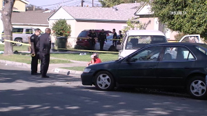 Officers interview suspect Maximino Delgado at the scene where he is accused of killing a 6-year-old girl while driving under the influence on Feb. 17, 2018. (Credit: OnScene.TV)