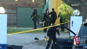 LAPD officers respond to a home invasion in Sherman Oaks on Feb. 28, 2018. (Credit: OnScene.TV)