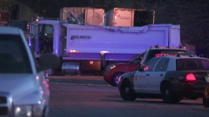 A truck and a Los Angeles County Sheriff's Department car are seen at a parking lot near Plaza Mexico in Lynwood on Feb. 25, 2018. (Credit: KTLA)