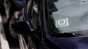 A sticker with the Uber logo is displayed in the window of a car on June 12, 2014 in San Francisco. (Credit: Justin Sullivan/Getty Images)