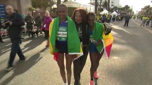 Ethiopians Tsehay Desalegn, left, and Sule Gedo celebrate after placing second and first, respectively, in the women's division at the L.A. Marathon on March 18, 2018. (Credit: KTLA)