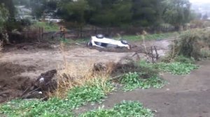 An SUV overturned on a flooded road in Santa Clarita on March 22, 2018, as seen in a photo released by the Santa Clarita Valley Sheriff's Station. 