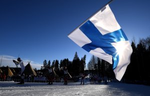 A Finland flag is waved as the skiers compete in the Men's Cross Country Skiathlon during the FIS Nordic World Ski Championships on February 25, 2017 in Lahti, Finland. (Credit: Matthias Hangst/Getty Images)