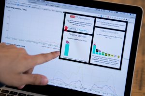 Louis Knight-Webb, co-founder of "Who Targets Me," a browser plug-in that tracks how political parties target people with advertising on Facebook, points to graphs of aggregated data from the 2017 general election on his laptop in London on May 31, 2017. (Credit: JUSTIN TALLIS/AFP/Getty Images)