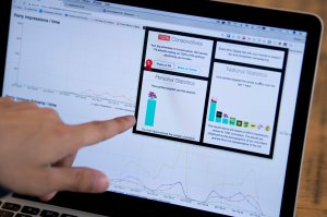 Louis Knight-Webb, co-founder of "Who Targets Me," a browser plug-in that tracks how political parties target people with advertising on Facebook, points to graphs of aggregated data from the 2017 general election on his laptop in London on May 31, 2017. (Credit: JUSTIN TALLIS/AFP/Getty Images)