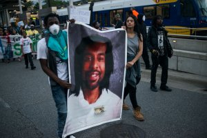 Protestors carry a portrait of Philando Castile on June 16, 2017 in St Paul, Minnesota. (Credit: Stephen Maturen/Getty Images)