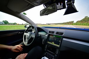 In this file photo, a driver presents a hands free self-driving system designed for motorways during a media event to showcase new automotive technologies. The vehicle model seen in this photo wasn't involved in the crashes. (Credit: Alexander Koerner/Getty Images)