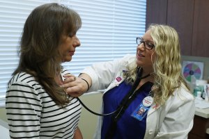 Ginger Rae is given a checkup by registered nurse practitioner Rachel Eisenberg at a Planned Parenthood health center on July 13, 2017, in Wellington, Fla. in this fight. (Credit: Joe Raedle/Getty Images)