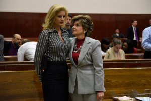 Summer Zervos, left, a former contestant on "The Apprentice," listens to her lawyer Gloria Allred in New York County Criminal Court on Dec. 5, 2017, in New York. (Credit: BARRY WILLIAMS/AFP/Getty Images)