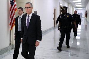 FBI Deputy Director Andrew McCabe is escorted by U.S. Capitol Police before a meeting with members of the Oversight and Government Reform and Judiciary committees in the Rayburn House Office Building on Dec. 21, 2017. (Credit: Chip Somodevilla/Getty Images)