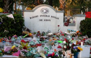 Flowers, candles and mementos sit outside one of the makeshift memorials at Marjory Stoneman Douglas High School in Parkland, Fla., on February 27, 2018. (Credit: RHONA WISE/AFP/Getty Images)