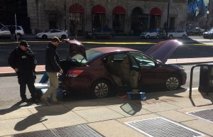 Secret Service officers inspect a car reportedly belonging to a man who shot himself outside the White House in Washington, D.C, on March 3, 2018. (Credit: THOMAS WATKINS/AFP/Getty Images)