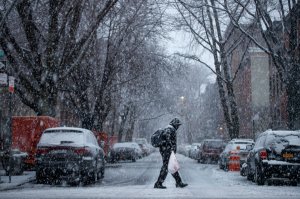 A man walks through the Boerum Hill neighborhood in Brooklyn during a snowstorm, March 7, 2018, in New York City. (Credit: Drew Angerer/Getty Images)