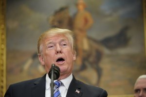 Donald Trump speaks before signing Section 232 Proclamations on Steel and Aluminum Imports in the Oval Office on March 8, 2018. (Credit: Jonah Mandel/AFP/Getty Images)