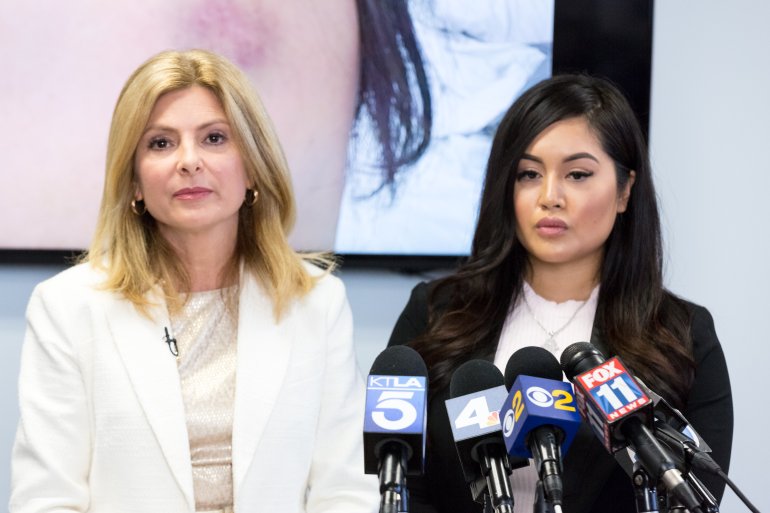 Andrea Buera, right, who is accusing Trey Songz of assaulting her, speaks during a press conference with her attorney Lisa Bloom in Woodland Hills on March 13, 2018. (Credit: Greg Doherty / Getty Images)