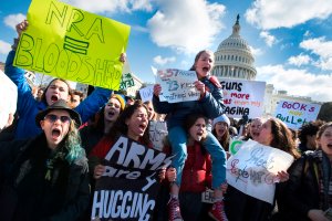 Students participate in a rally on Capitol Hill with other students from DC, Maryland and Virginia in their Solidarity Walk-Out to urge Republican leaders in Congress "to allow votes on gun violence prevention legislation," March 14, 2018. (Credit: Jim Watson / AFP / Getty Images)
