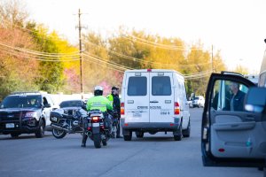 Crime Scene vehicles and local law enforcement work the scene of a bombing on March 19, 2018, near the 4800 block of Dawn Song Drive in Austin, Texas. Police and bomb experts are investigating a fourth mysterious bombing this month in the Texas state capital, a blast that injured two young men in their 20s. (Credit: SUZANNE CORDEIRO/AFP/Getty Images)