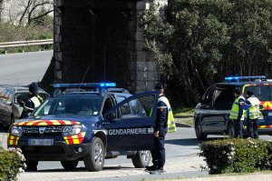 French gendarmes block an access to Trebes, where a man took hostages at a supermarket on March 23, 2018 in Trebes, southwest France. (Credit: ERIC CABANIS/AFP/Getty Images)