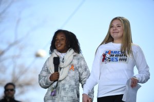 Martin Luther King Jr's granddaughter Yolanda Renee King speaks next to Marjory Stoneman Douglas High School student Jaclyn Corin during the March for Our Lives Rally in Washington, D.C. on March 24, 2018. (Credit: JIM WATSON/AFP/Getty Images)