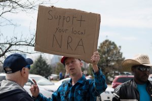 Pro-gun advocate Trevor Jackson talks to an anti-gun supporter  during the March for Our Lives rally on March 24, 2018, in Oklahoma City. (Credit: J. Pat Carter/Getty Images)
