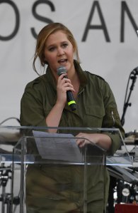 Actress Amy Schumer addresses the crowd as they protest for tighter gun laws during the student organized 'March For Our Lives' rally in Los Angeles, California on March 24, 2018. (Credit: MARK RALSTON/AFP/Getty Images)