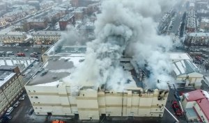 An aerial view taken on March 25, 2018, with a drone shows a fire of a shopping centre in Kemerovo, Russia, that killed 64 people. (Credit: STR / AFP / Getty Images)