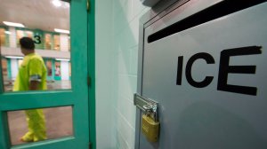 An immigration detainee stands near an U.S. Immigration and Customs Enforcement grievance box in the high security unit at the Theo Lacy Facility, a county jail which also houses immigration detainees arrested by the U.S. Immigration and Customs Enforcement, March 14, 2017, in Orange, Calif. (Credit: ROBYN BECK/AFP/Getty Images)