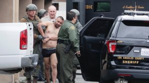 Isaias De Jesus Valencia, suspected of killing a Pomona police officer, is taken into custody following a lengthy standoff with police on March 10, 2018. (Credit: Irfan Kahn/Los Angeles Times)
