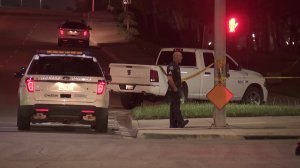 Officers respond to a scene near Von Karman Avenue and Quartz in Irvine where police shot a man on March 27, 2018. (Credit: KTLA)