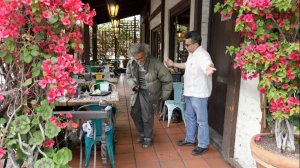 David Solorzano, manager at La Luz del Dia restaurant at Olvera Street, asks a panhandler to leave on March 7, 2018. Merchants are upset about the mayor's plan to house homeless people in trailers on a city-owned parking lot at Arcadia and Alameda streets for up to three years. The City Council is expected to approve the plan on March 9. (Credit: Myung J. Chun / Los Angeles Time)