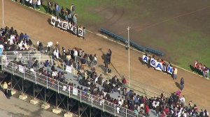 Students at Francis Polytechnic High School in Sun Valley hold signs reading "Never Again" as part of the National School Walkout on March 14, 2018. (Credit: KTLA)