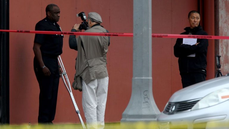 An investigator photographs then-LAPD Officer Clifford Proctor after he shot and killed Brendon Glenn, 29, near the Venice boardwalk. (Credit: Irfan Khan/Los Angeles Times)