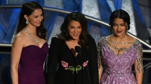 Actress Ashley Judd, Italian-American actress Annabella Sciorra and Mexican-Lebanese actress Salma Hayek deliver a speech about sexual harassment in the entertainment industry during the 90th Annual Academy Awards show on March 4, 2018, in Hollywood. (Credit: Mark Ralston/AFP/Getty Images)