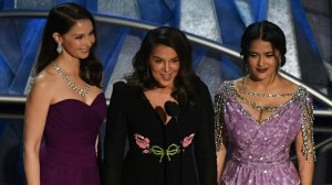 Actress Ashley Judd, Italian-American actress Annabella Sciorra and Mexican-Lebanese actress Salma Hayek deliver a speech about sexual harassment in the entertainment industry during the 90th Annual Academy Awards show on March 4, 2018, in Hollywood. (Credit: Mark Ralston/AFP/Getty Images)