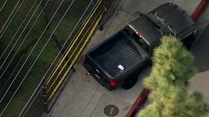 A truck sits on the pavement outside Paramount High School after five students were struck there on March 19, 2018. (Credit: KTLA)