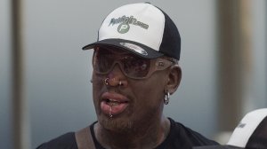 Former NBA basketball player Dennis Rodman of the U.S. walks from the arrival gate returning from his trip to North Korea at Beijing's international airport on June 17, 2017. (Credit: NICOLAS ASFOURI/AFP/Getty Images)