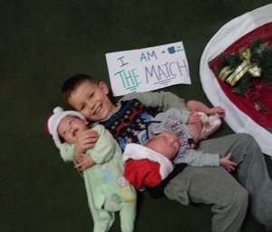 Michael Demasi Jr. pose with his 4-month-old twin brothers, who have chronic granulomatous disease, in this undated photo. (Credit: Robin Pownall/CNN)