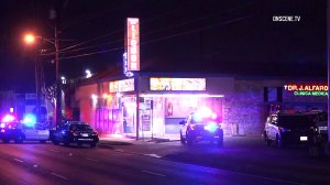 A suspected burglar died in police custody Sunday night in Santa Ana. (Credit: OnScene.TV)