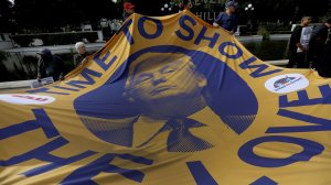 More than 100 people attended a press conference and rally in Beverly Hills on the eve of President Trump's visit. (Credit: Francine Orr / Los Angeles Times)