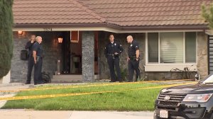 Police investigate a shooting that took place during a domestic incident in Tujunga on March 29, 2018. (Credit: KTLA) 