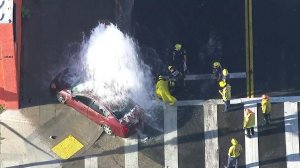 A car involved in a police pursuit crashed into a fire hydrant in South Los Angeles on March 27, 2018. (Credit: KTLA)