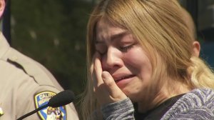 Guadalupe Gutierrez speaks March 15, 2018, in Altadena, asking for help finding her husband's killer. (Credit: KTLA)