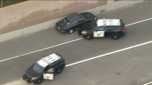 A pursuit driver narrowly evades patrol vehicles that attempted to trap him on the 210 Freeway in the San Gabriel Valley on April 12, 2018. (Credit: KTLA)