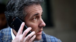 Michael Cohen, U.S. President Donald Trump's personal attorney, takes a phone call as he sits outside near the Loews Regency hotel on Park Ave on April 13, 2018, in New York City. Following FBI raids on his home, office and hotel room, the Department of Justice announced that they are placing him under criminal investigation. (Credit: Yana Paskova/Getty Images)