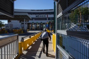 A man walks to Mexico after crossing the international bridge on the U.S.-Mexico border in Nuevo Laredo, Feb. 22, 2017. (Credit: GUILLERMO ARIAS / AFP / Getty Images)
